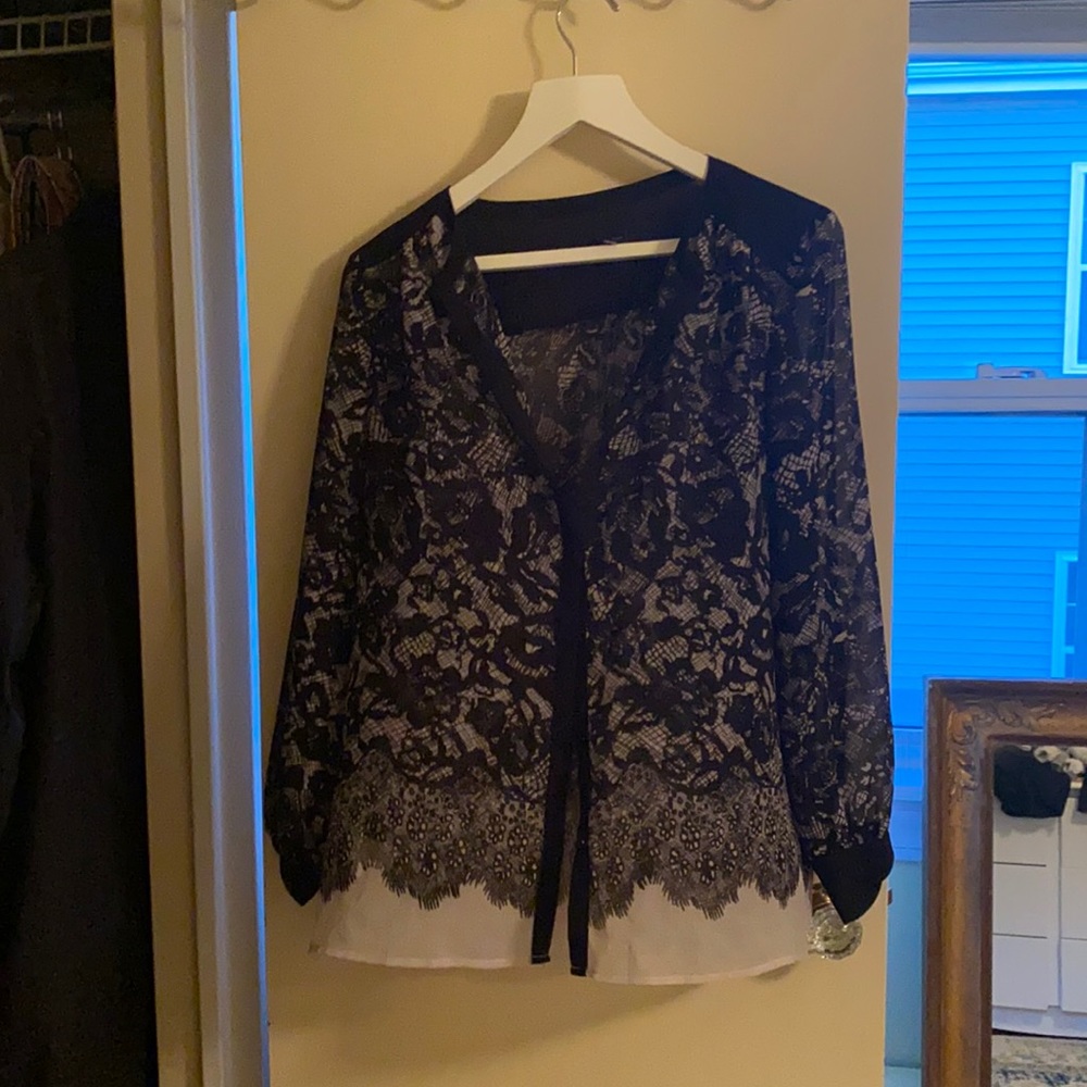 Black and white lace patterned blouse